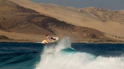 Surfer on a wave at Punta Escondida Surf Camp, Salina Cruz, Mexico